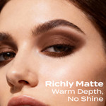 Close-up of a softly blended Curious deep brown smokey eye makeup look with warm matte tones, showcasing even application, smooth transitions, and a natural, no-shine finish.