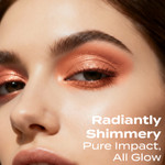 Close-up beauty image of a model wearing Sassy Eye Shadow, revealing a radiant pumpkin-orange shimmer across the lids with smooth blending, vibrant pigment, and a warm glowing finish.