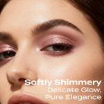 Model wearing Sweet Cheeks mineral eyeshadow with a softly shimmery pink finish, creating a delicate glow and elegant eye look.