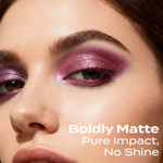 Detailed close-up of a model wearing Sweet Face Minerals Vibrant eyeshadow in a bold plum mauve eye look with smooth blending and high color impact.