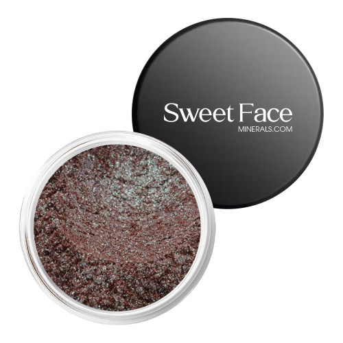 Mysterious loose mineral eyeshadow by Sweet Face Minerals in an open jar, featuring a deep smoky plum-brown shade with rich, multidimensional shimmer.