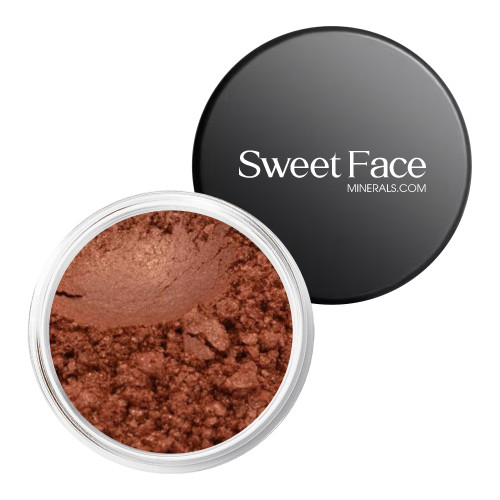 Sweet Face Minerals Neurotic loose mineral eyeshadow in a warm copper tone, shown in an open cosmetic jar with branded black lid.