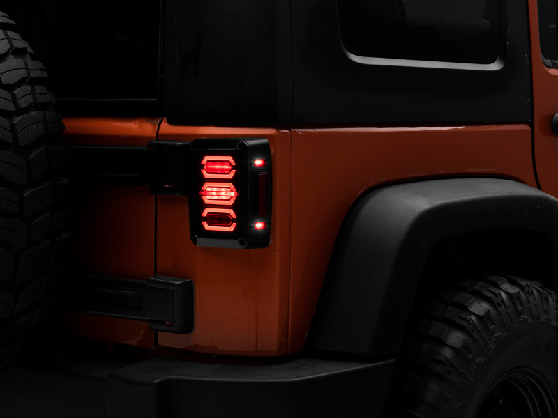 Raxiom 07-18 Jeep Wrangler JK LED Tail Lights- Black Housing (Smoked Lens) - J106751 Photo - Primary