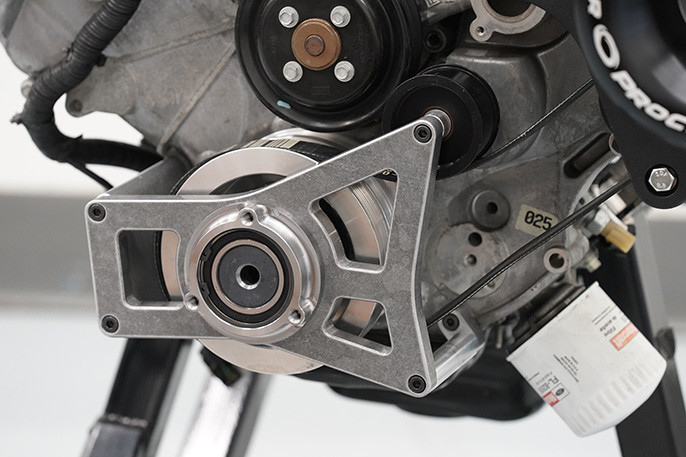 Polished ProCharger crank support installed on F150 Coyote engine with Innovators West balancer