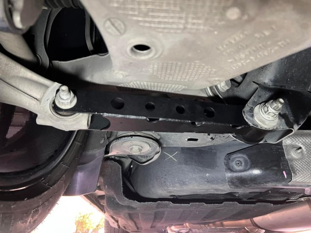 FenFabrication red rear toe links installed on Ford Explorer ST suspension