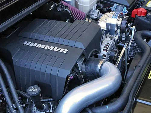 ProCharger tuner kit installed on 6.2 Hummer H2 engine with intercooler and piping