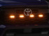 Raxiom 24-26 Toyota Tacoma Pre Runner/ TRD Off-Road/ TRD Sport Amber LED Grille Light- Clear Lens - TT65013 Photo - Primary