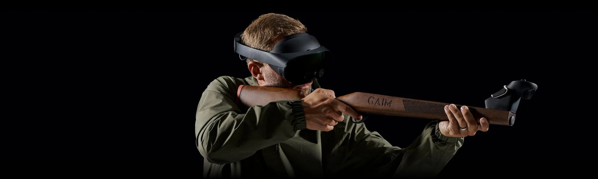 Shooter wearing a VR headset shouldering a GAIM training stock