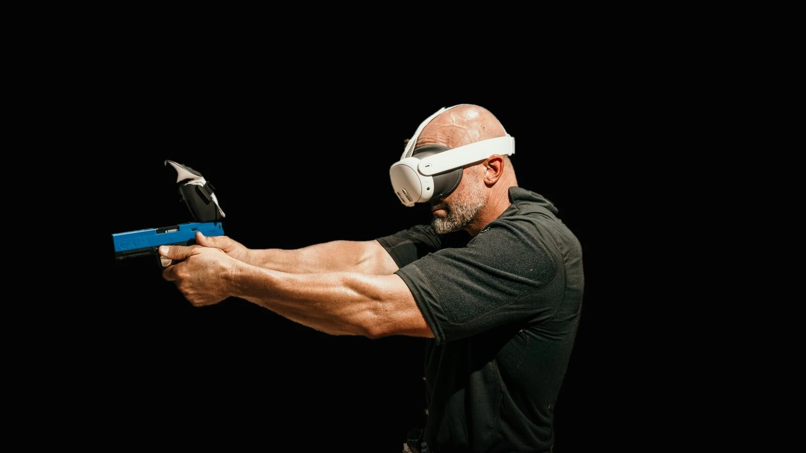 Shooter training with a GAIM pistol trainer and VR headset