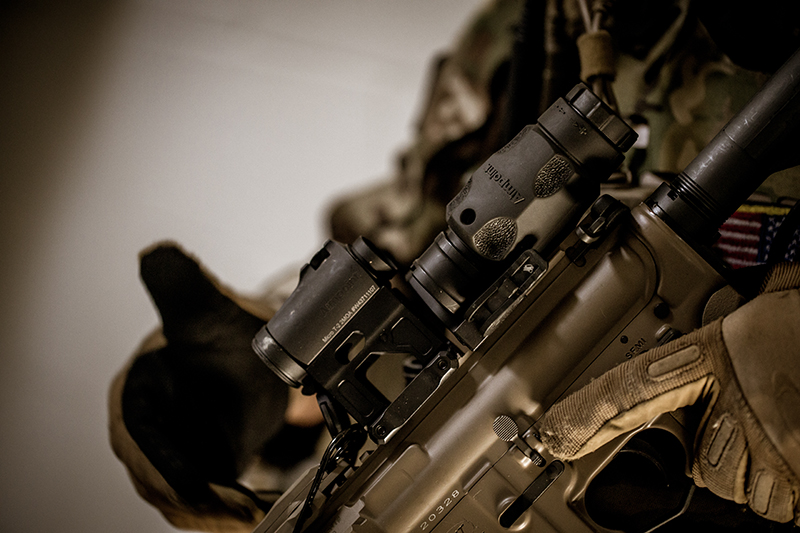 Aimpoint magnifier mounted behind a red dot sight