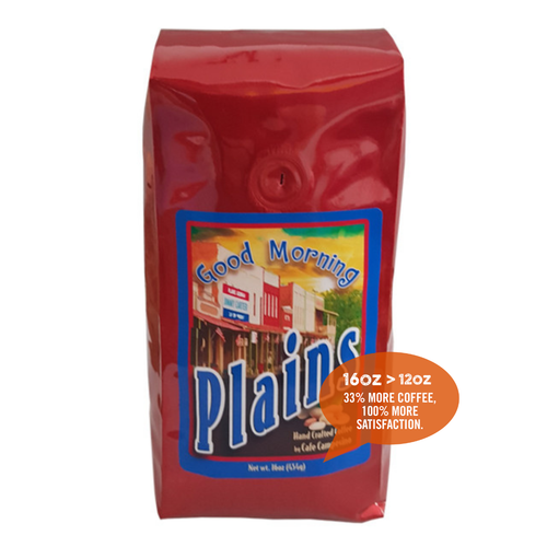 16 oz bag of Good Morning Plains Blend fair trade, organic, shade-grown coffee. Badge reads: 16oz is greater than 12oz, 33% more coffee, 100% more satisfaction.