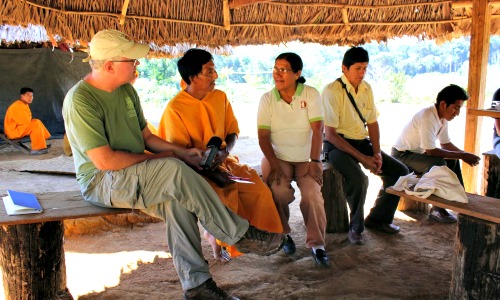 Café Campesino founder Bill Harris speaks with farmer partners from CAC Pangoa in Peru.