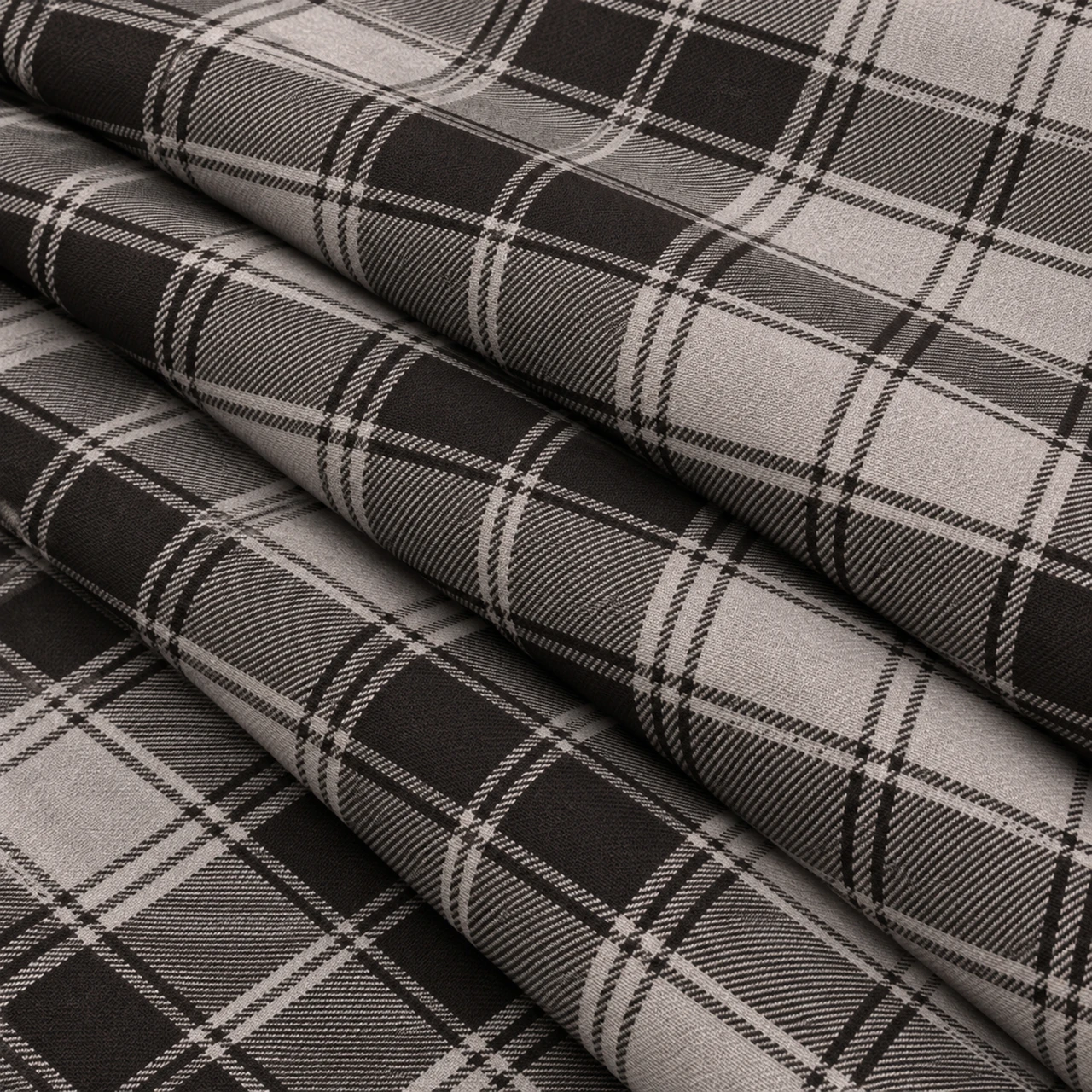 Douglas Grey lightweight tartan fabric arranged in folds