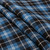 Clark Ancient lightweight tartan fabric arranged in folds