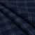 Douglas Grey Navy lightweight tartan fabric arranged in folds