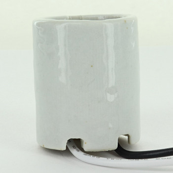 E-26 Porcelain Lamp Socket with 6/32 Mounting Grommets and 21in Long 18/1 105Deg Wire Leads. Lamp Socket rated Maximum 660W, 600V.  Includes Cardboard Insulator.