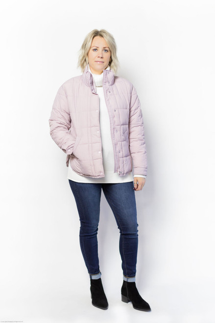 f you're adding a new jacket to your fall/winter wardrobe, put this short puffer at the top of your shopping list. The lightweight water-repellent quilted fabric keeps you warm and dry without extra bulk weighing you down, making it an easy, versatile topper for any casual outfit that needs a cozy layer.

Product Details and Care:

Snap and zip front closure with placket, mock neck
Relaxed fit
26" length
Long set-in sleeve
100% Nylon

Water-repellant, fully lined, front welt pockets

100% Nylon
MACHINE WASH DELICATE CYCLE COLD WATER,SEPARATELY,DO NOT BLEACH,LINE DRY,LOW IRON IF NEEDED