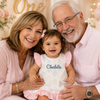 Baby girl wearing a personalized first birthday outfit with an embroidered monogram during a birthday celebration