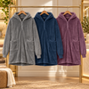 Port Authority plush fleece ponchos in grey, navy, and purple showing oversized hoods, half-zip fronts, and patch pockets. Monogram option 3