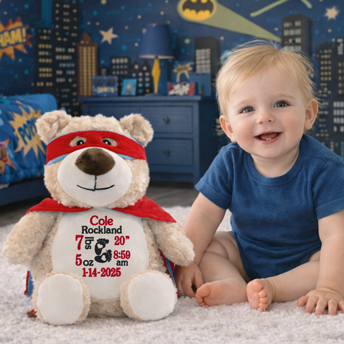 Personalized superhero bear stuffed animal embroidered with baby birth stats in superhero nursery setting