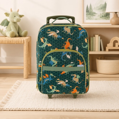 Personalized dragon kids rolling suitcase displayed in a soft upscale boutique setting