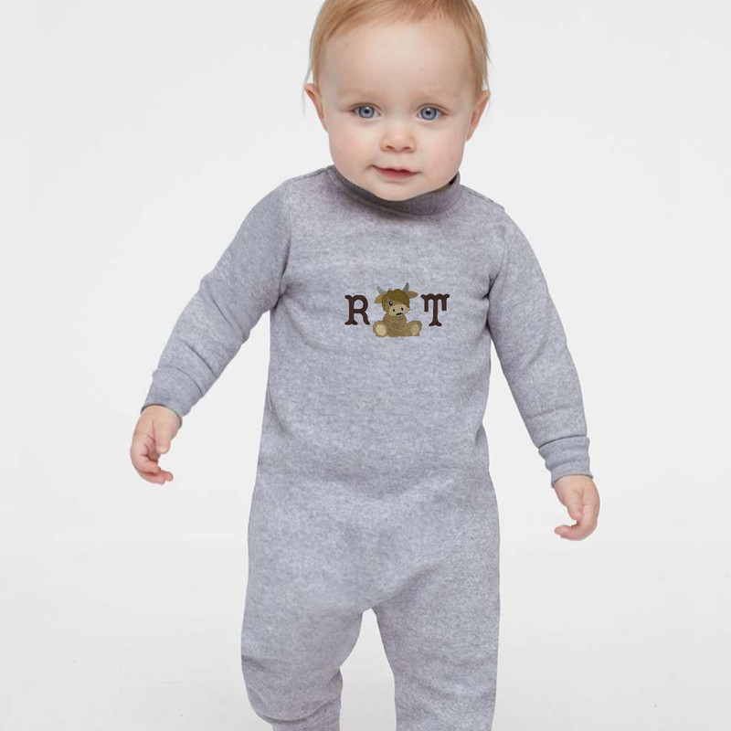 Wrap your little one in cozy warmth with our Monogrammed Highland Cow One-Piece. Personalize this cuddly baby fleece jumpsuit with beautiful highland cow embroidery for an adorable touch. The perfect blend of comfort and cuteness awaits—order now and cherish the sweet moments in style!