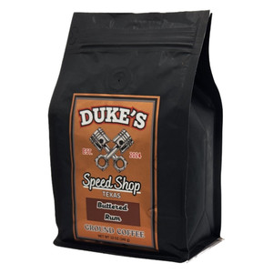 Buttered Rum flavored coffee in a black 12oz bag from Dukes Speed Shop Texas.