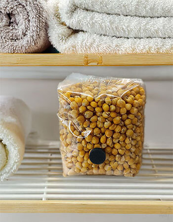 Mushroom grain bag colonising on a shelf in a warm airing cupboard