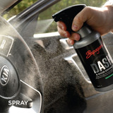 car steering wheel sprayed with dashboard interior cleaner