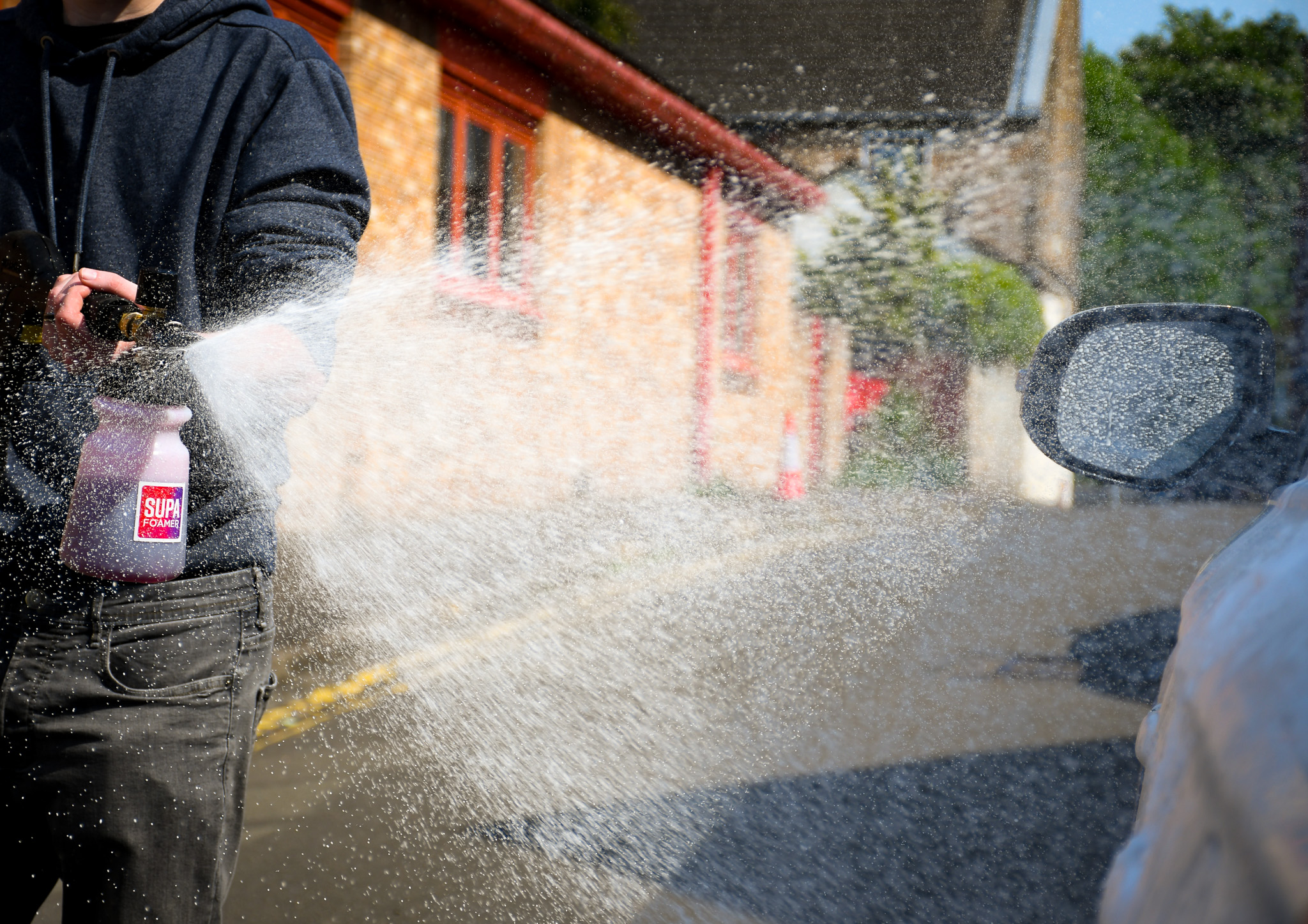 snow foamer spraying snow foam