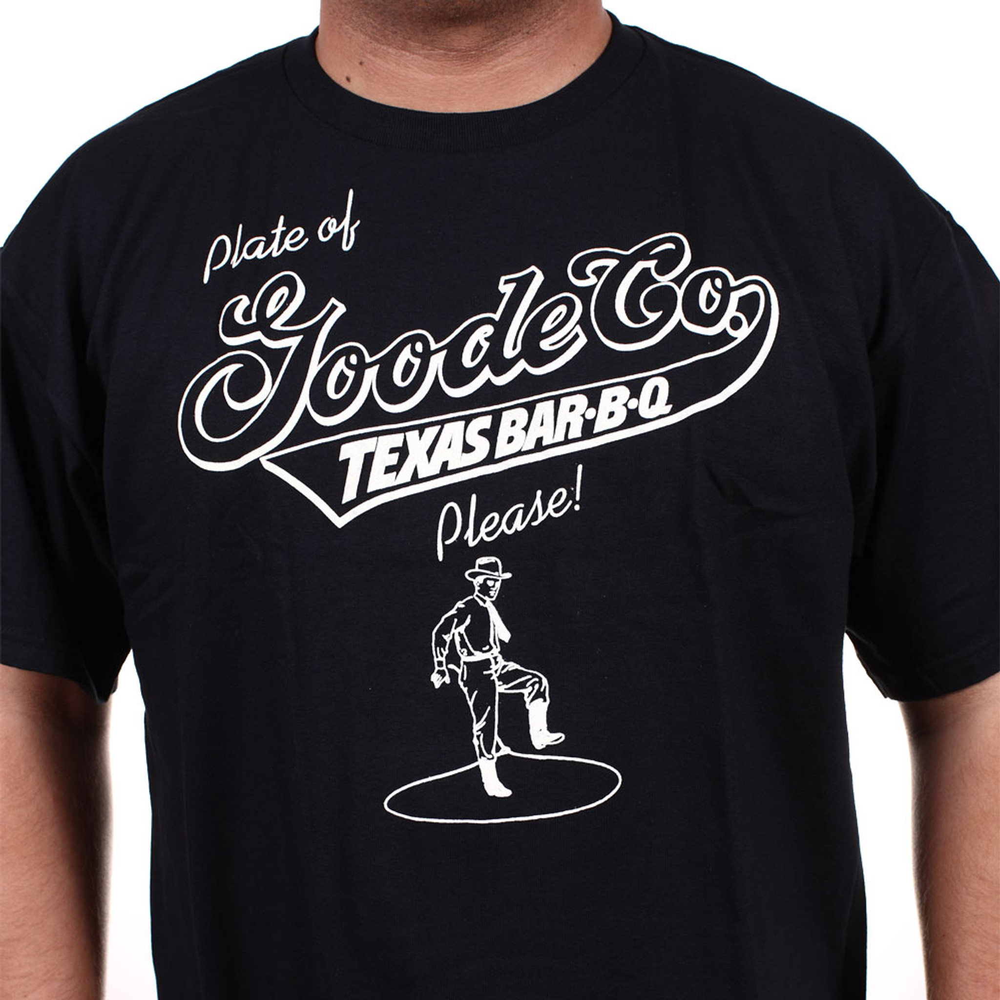 Proud Texan wearing a black cotton t-shirt with Goode Company's logo on the front and "You Might Give Some Serious Thought to Thanking Your Lucky Stars You're in Texas" on the back.