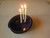 Tamara S Gordon Ceramics. Three candle holding pot - - huh?