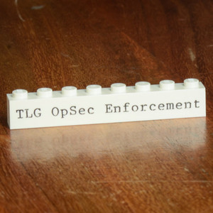 TLG Opsec Badge Brick