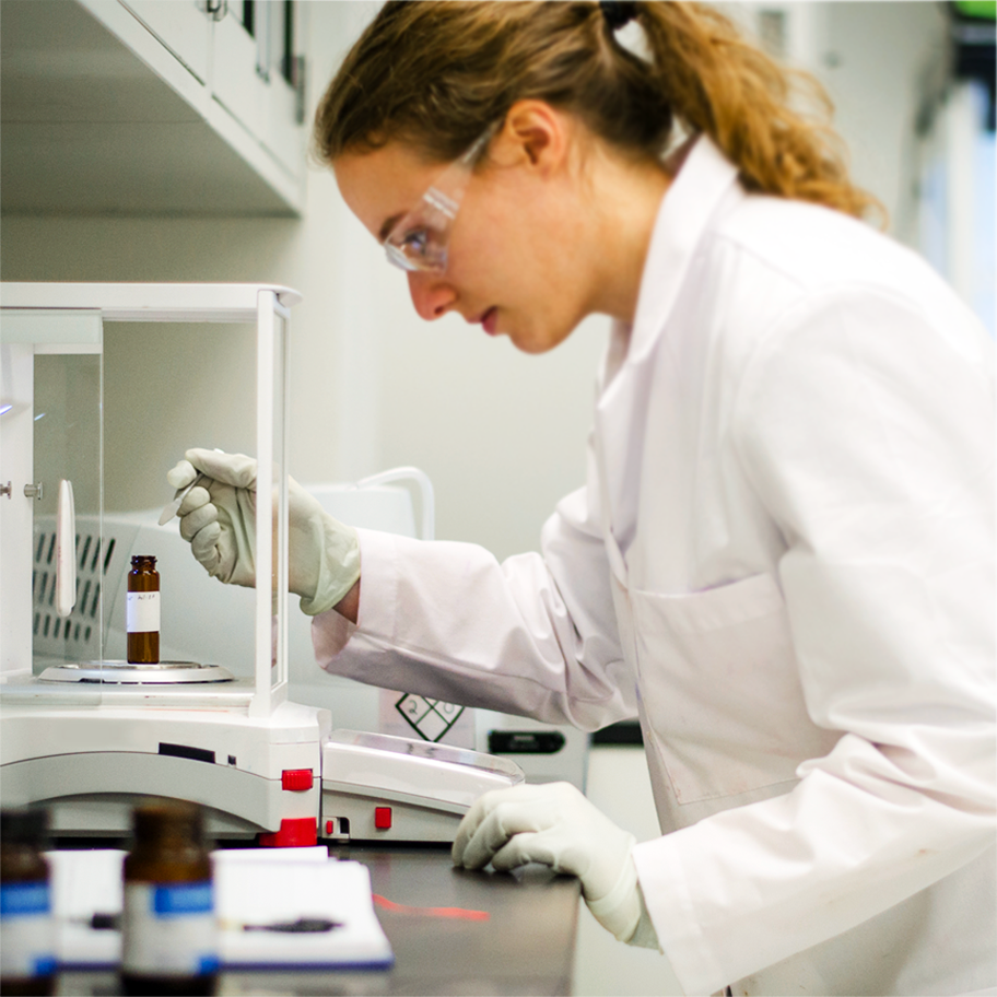 Woman Testing Sample in a lab