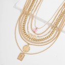 The Luxe Butterfly Honey Necklace Set: Embrace the epitome of luxury with this seven-piece ensemble