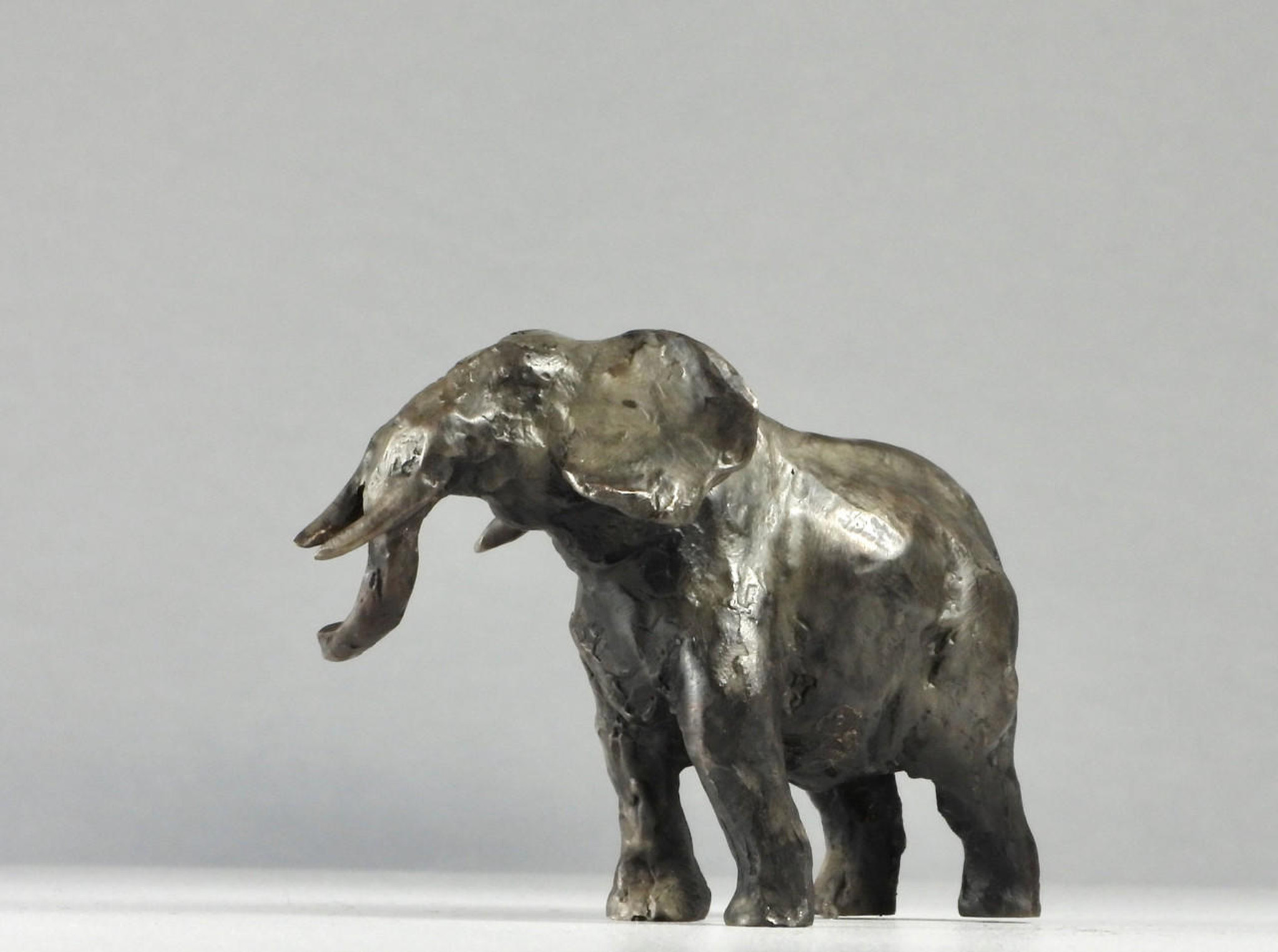 Tiny Giant I, 2.5", Miniature Bronze Elephant Sculpture by Kindrie Grove of Canada | available in the elk & HAMMER Gallery of Bozeman, Montana; curated by Ashley Childs, artist, maker, owner and creative director of elk & HAMMER.