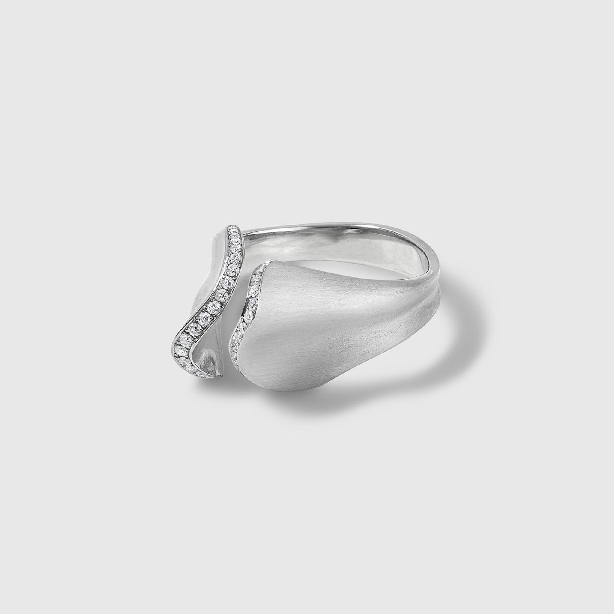 Couture, "Influence" Platinum and Diamond Sculptural ring by Ashley Childs The INFLUENCE ring from the Theory Collection by ASHLEY CHILDS; matt-finish, platinum and 0.15ct diamonds (SI/VS); sculptural, feminine, delicate, made to order, prices based on ring, size 7