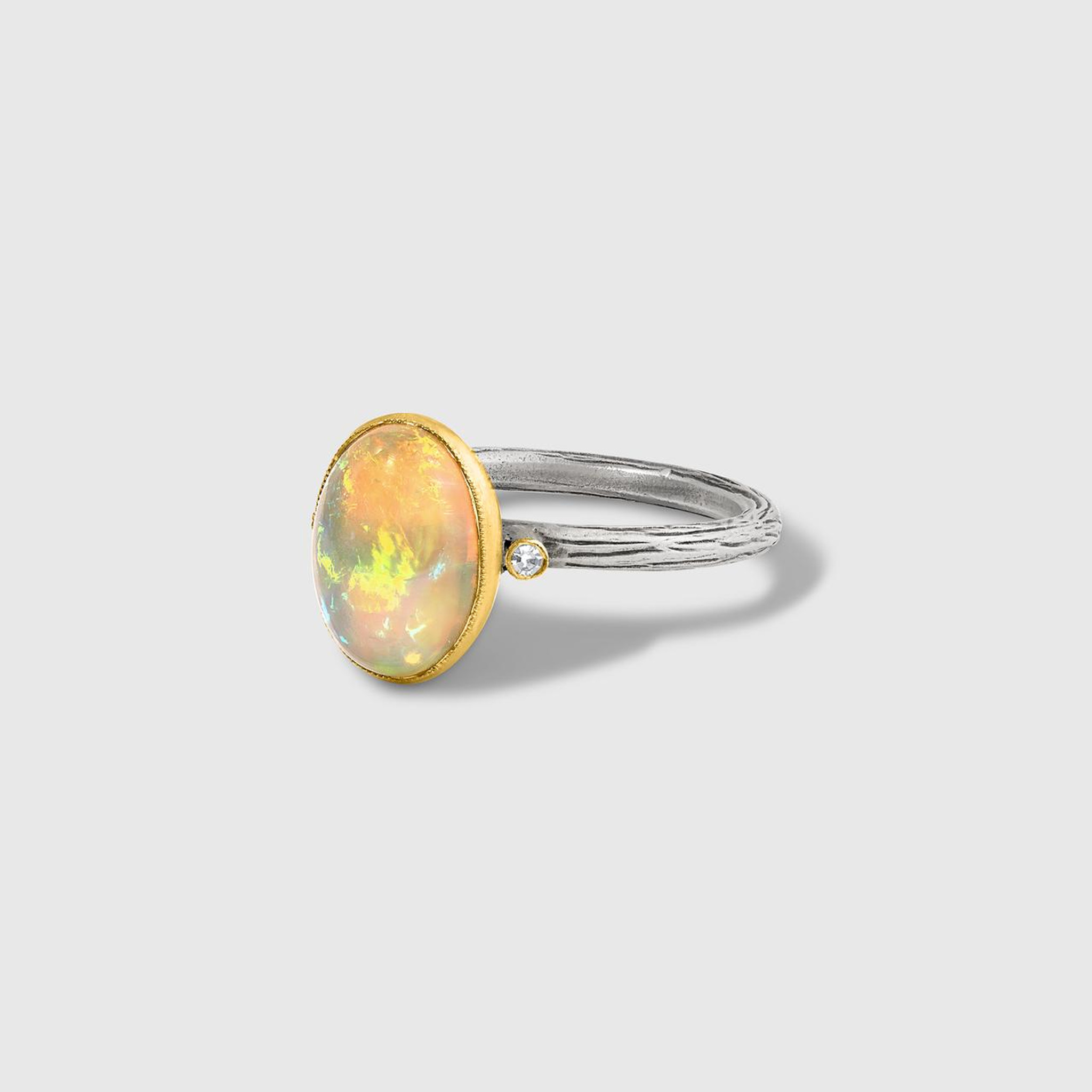 Prehistoric Works Oval, Opal Ring with Side Diamonds 