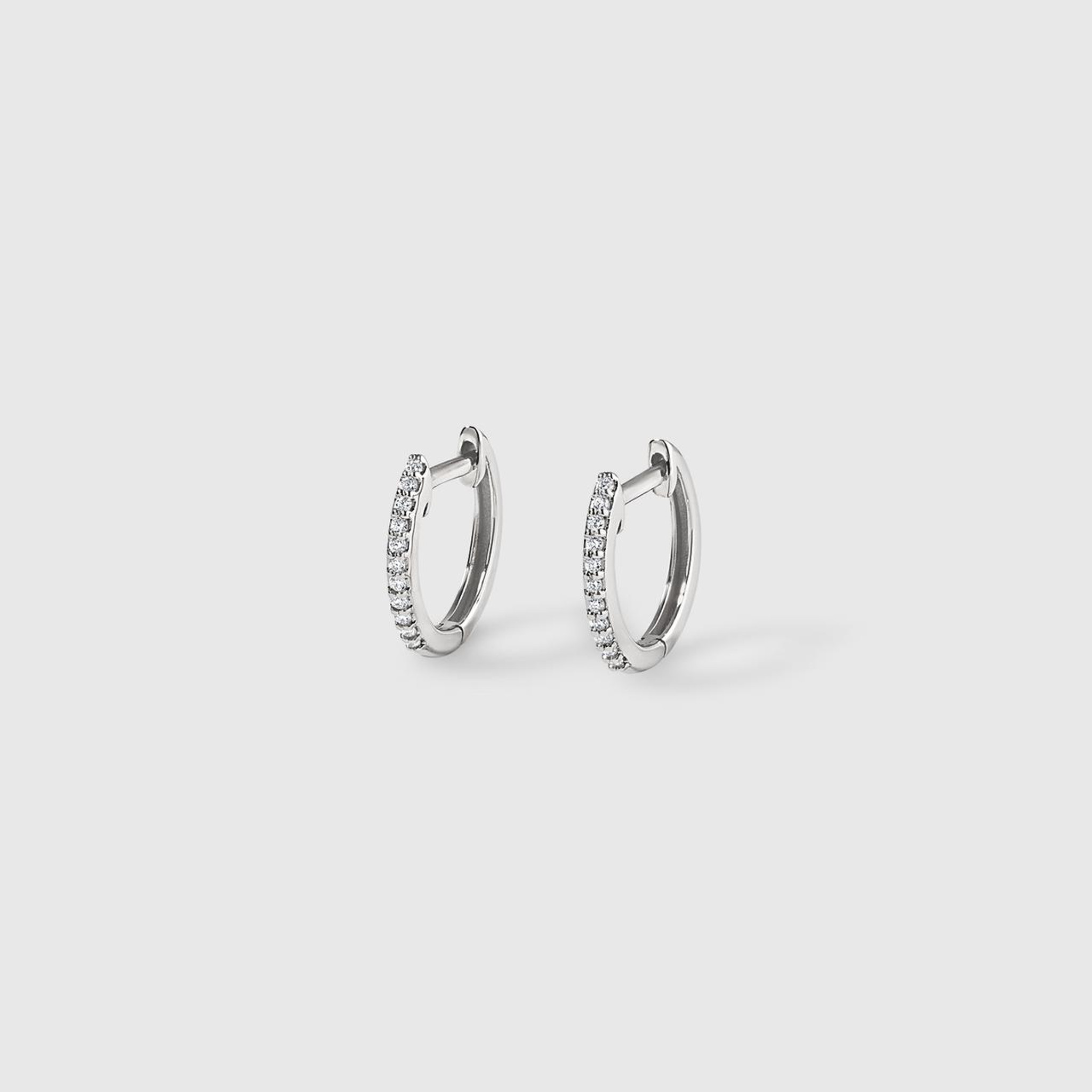 Classic, Small, 14kt White Gold Diamond Hoop Earrings. These stunners are small yet sure to make a statement day or night.  By Sophia by Design of Cherry Hill, NJ.