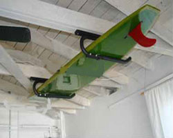 Handmade surfboard paddle board wall racks by Hawaiian Gun Rack