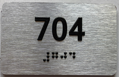 ADA APARTMENT NUMBER 704 SIGN