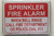 SPRINKLER FIRE ALARM WHEN BELL RINGS CALL 911   Signage