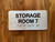 Storage Room 7 Sign with Raised Letters & Grade 2 Safety Sign