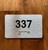 Apartment number 337 Ada Sign