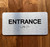 Entrance With Sign with Raised Letters Braille Sign