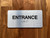 Entrance With Sign with Raised Letters Safety Sign