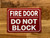 fire-door-do-not-block-sign-7-x-10-inches-mounting-holes.jpg