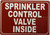 Sprinkler control valve inside sign
