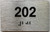 HOTEL DIRECTIONAL SIGN APARTMENT NUMBER 202