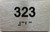 HOTEL DIRECTIONAL SIGN APARTMENT NUMBER 323